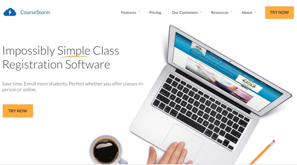 A screenshot of CourseStorm's homepage. A hand is using a laptop to register for a class through CourseStorm's platform. Test includes Impossibly simple class registration software. Save time. Enroll more students. Perfect whether you offer classes in-person or online.